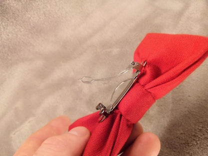 Red bow with black flower vine