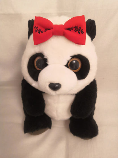 Red bow with black flower vine